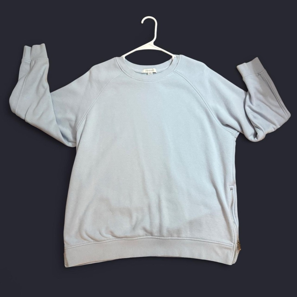 Primark light blue sweatshirt with zippers on side.  Size M.